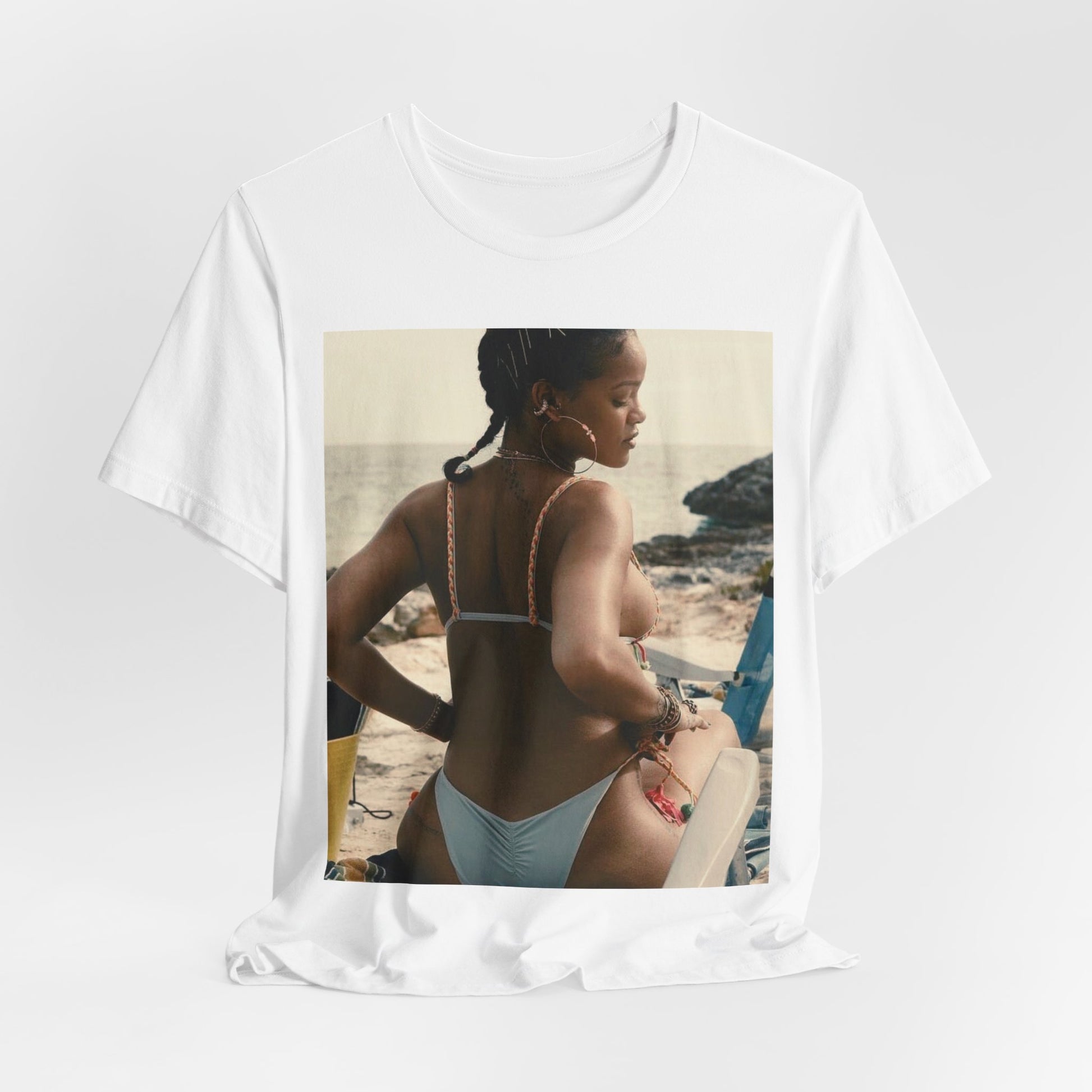 A black graphic t-shirt featuring a graphic of Rihanna as a bikini babe in paradise.