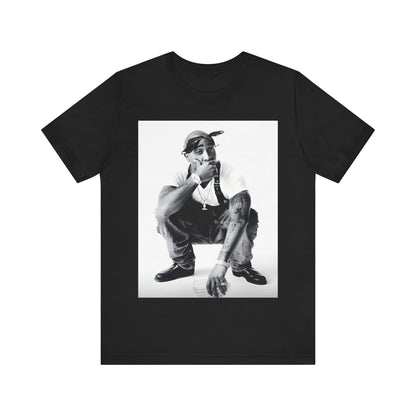 A black graphic t-shirt featuring a graphic of Tupac with a conscious rap vibe.