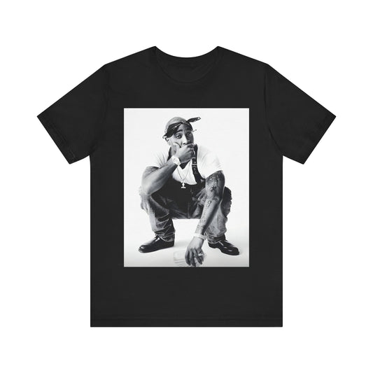 A black graphic t-shirt featuring a graphic of Tupac with a conscious rap vibe.