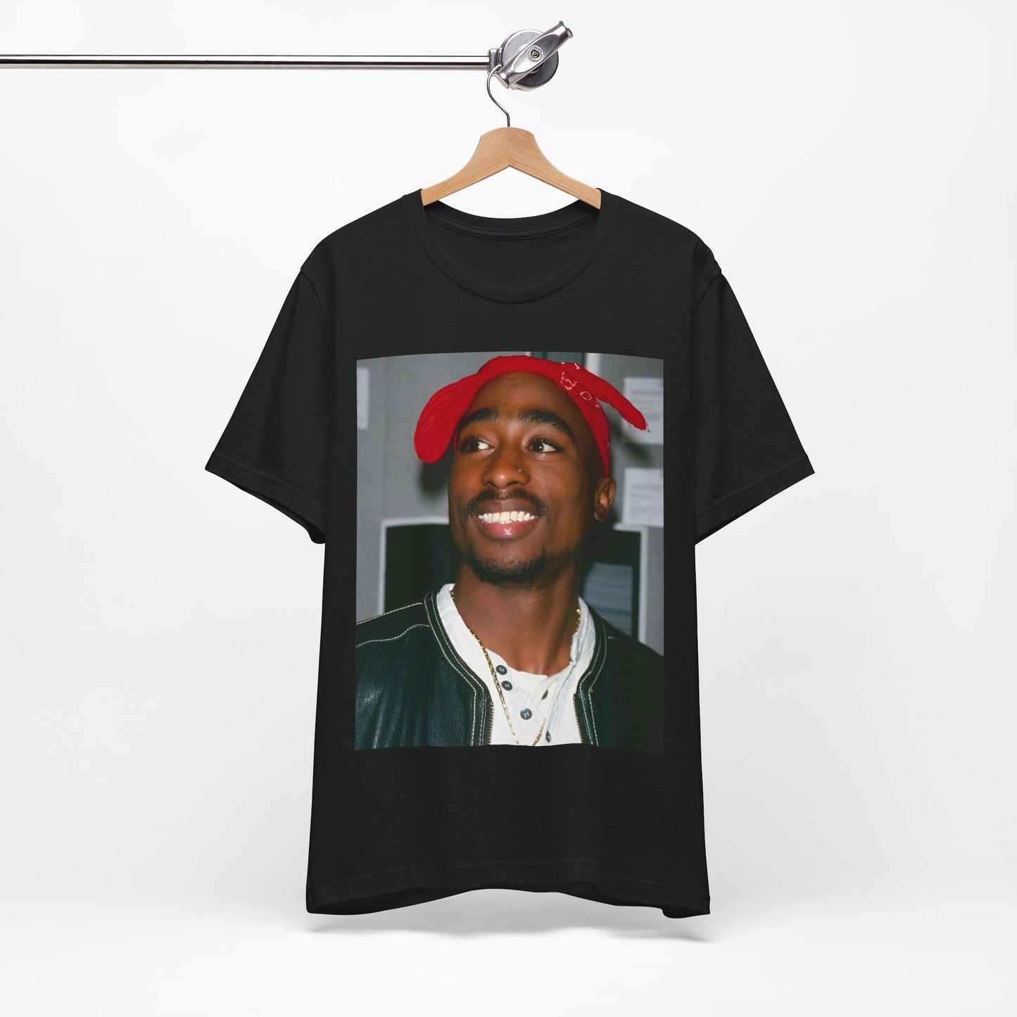 A black graphic t-shirt featuring a graphic of Tupac with his iconic bandana style.