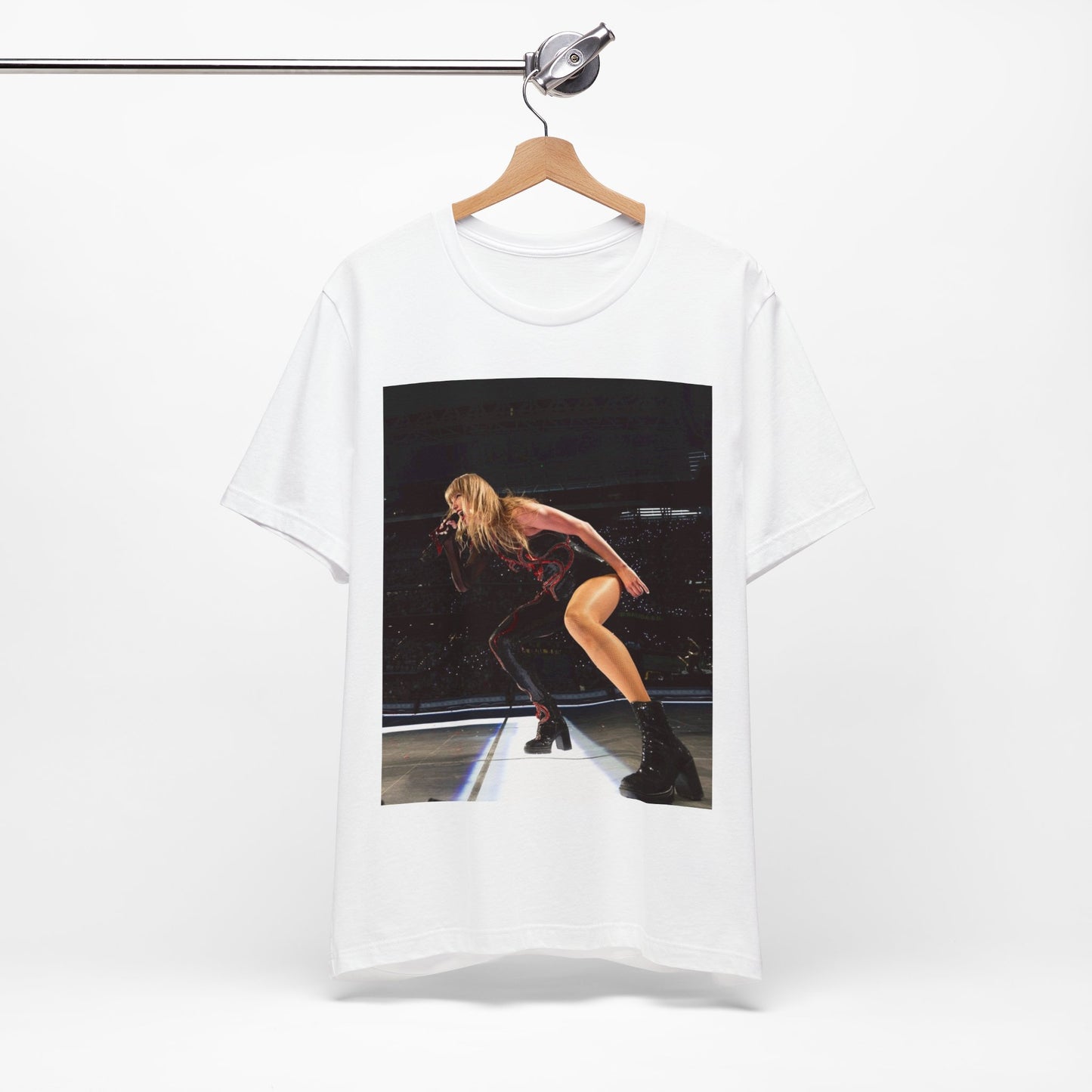 A black graphic t-shirt featuring a fierce graphic of Taylor Swift on stage.