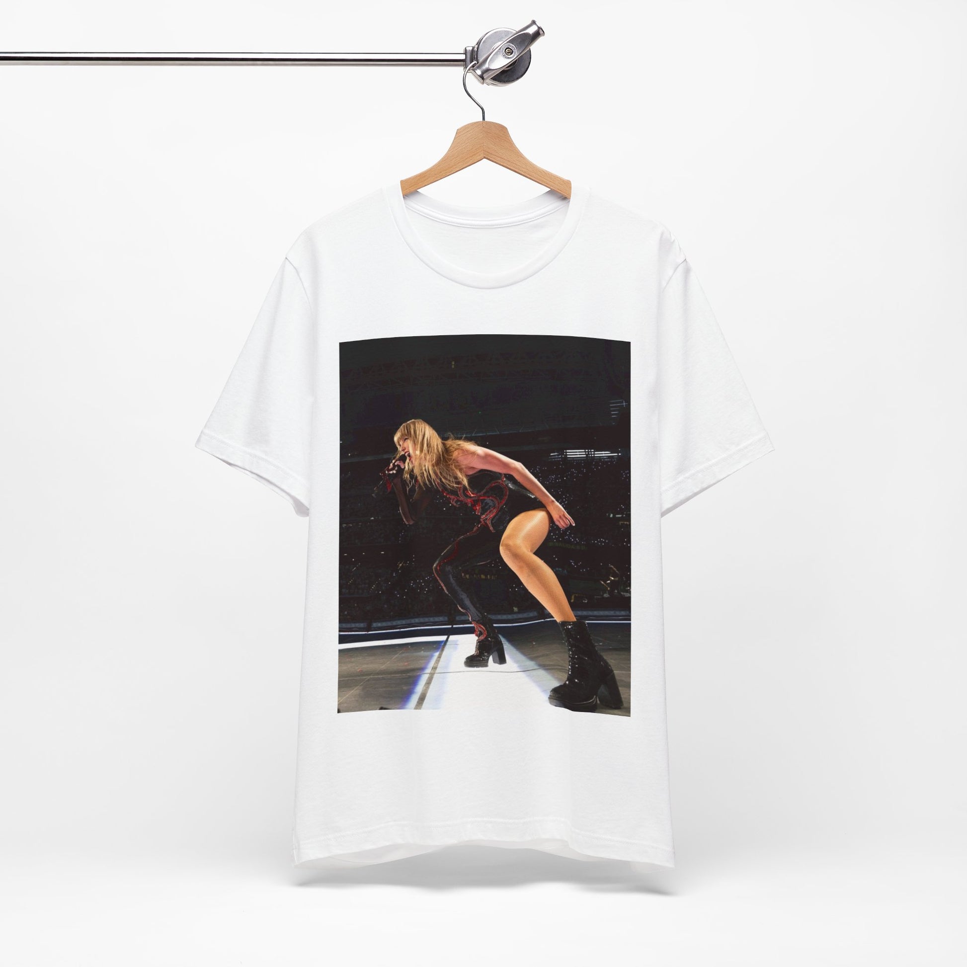 A black graphic t-shirt featuring a fierce graphic of Taylor Swift on stage.