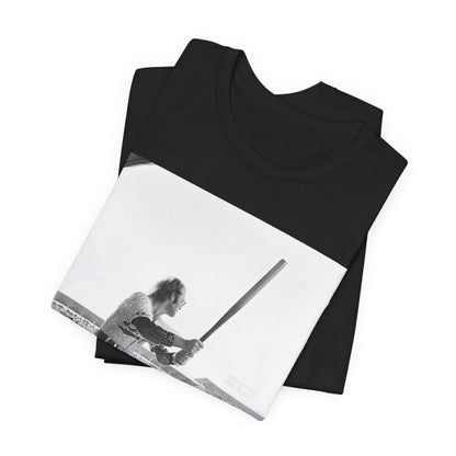 A black graphic t-shirt featuring a black and white graphic or photo related to Elton John's 1975 tour in America.