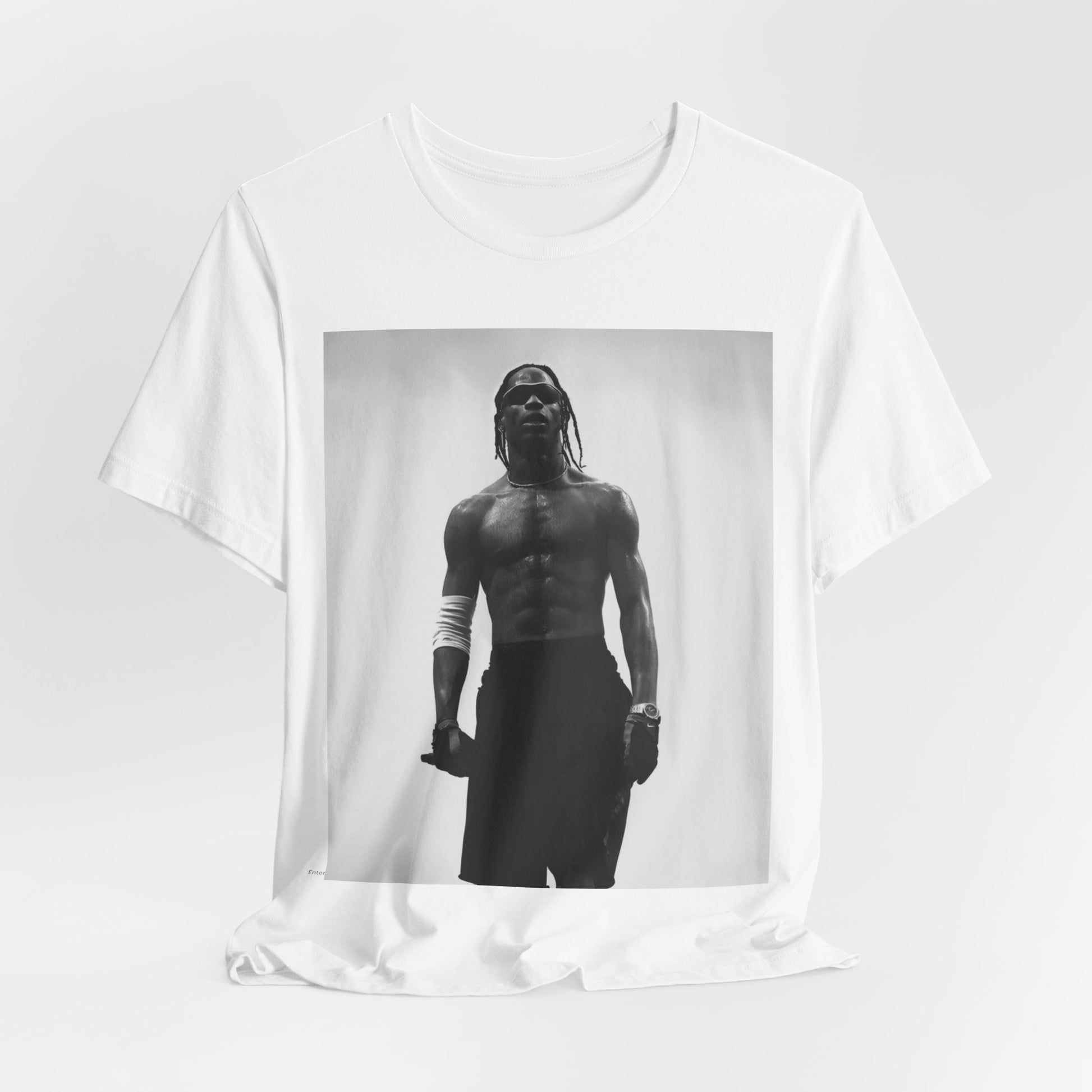 A black graphic t-shirt featuring a black and white portrait photo of Travis Scott.