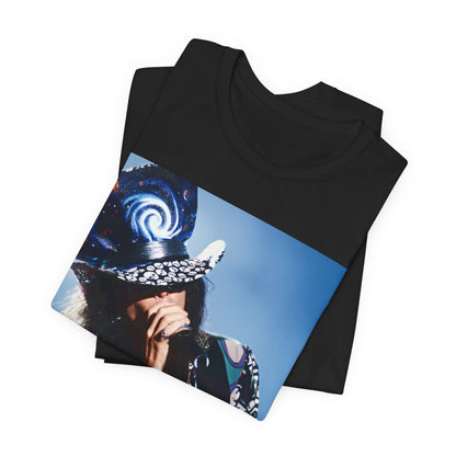 A black graphic t-shirt featuring a vintage 90s photo or illustration of Aerosmith performing live on stage, with band members in dynamic poses.