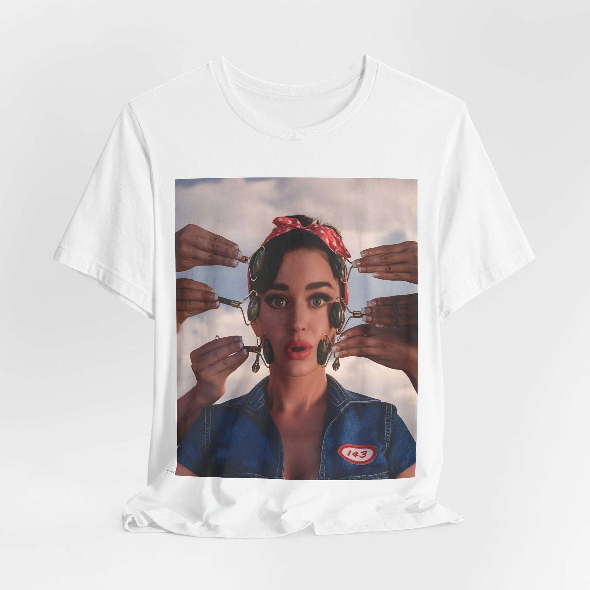 A black graphic t-shirt featuring a modern pop essential graphic of Katy Perry.