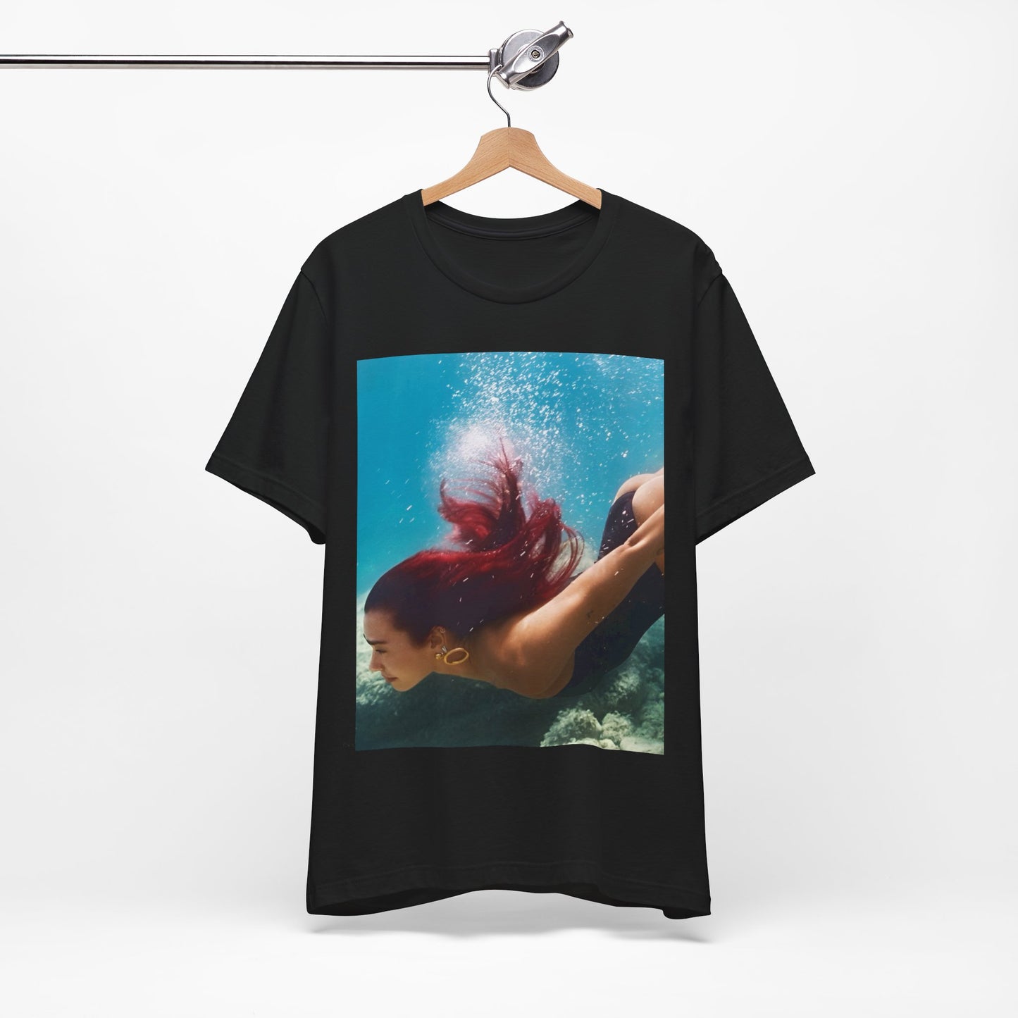 A black graphic t-shirt featuring a graphic related to Dua Lipa's 'Radical Optimism' album.