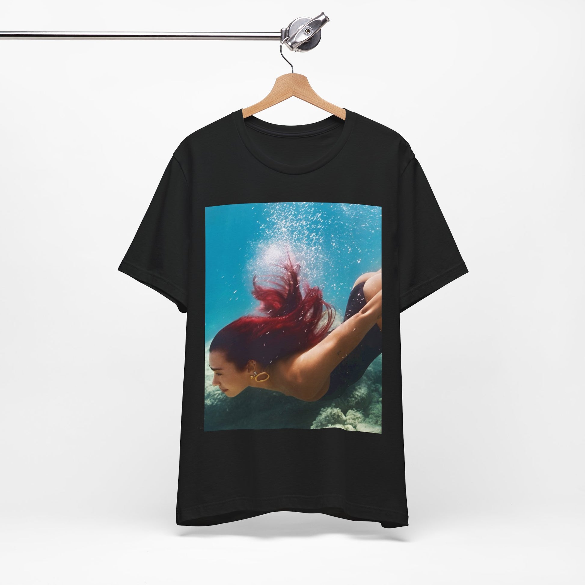A black graphic t-shirt featuring a graphic related to Dua Lipa's 'Radical Optimism' album.