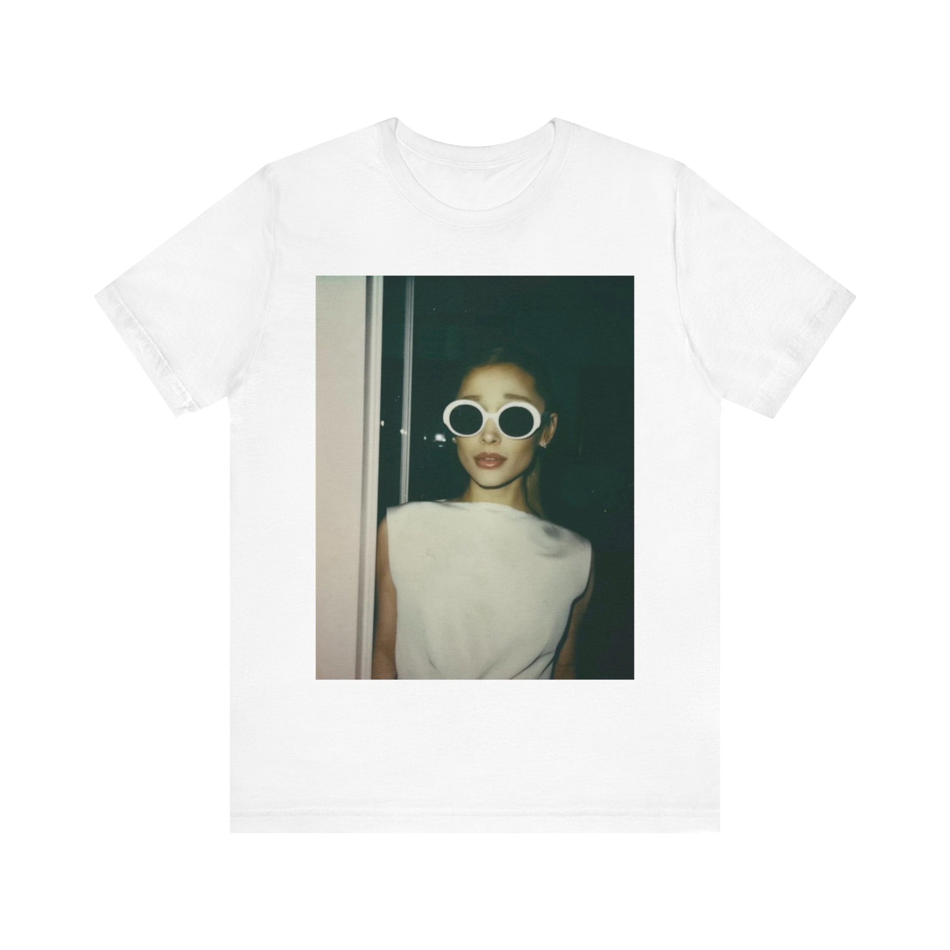 A black graphic t-shirt featuring a retro Polaroid-style photo of Ariana Grande.