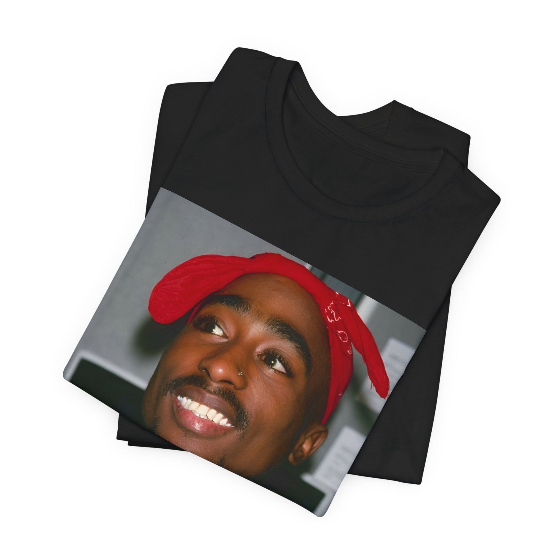 A black graphic t-shirt featuring a graphic of Tupac with his iconic bandana style.