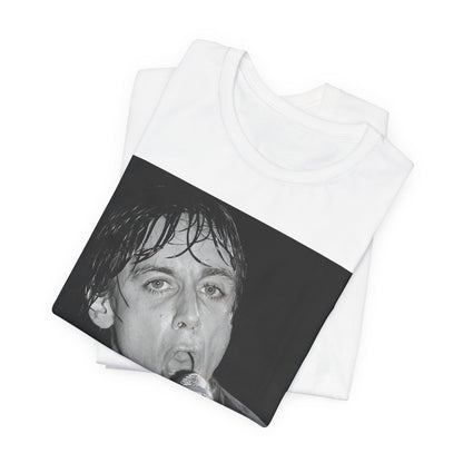 A black graphic t-shirt featuring a 70s graphic or photo of Iggy Pop performing in a wild concert.