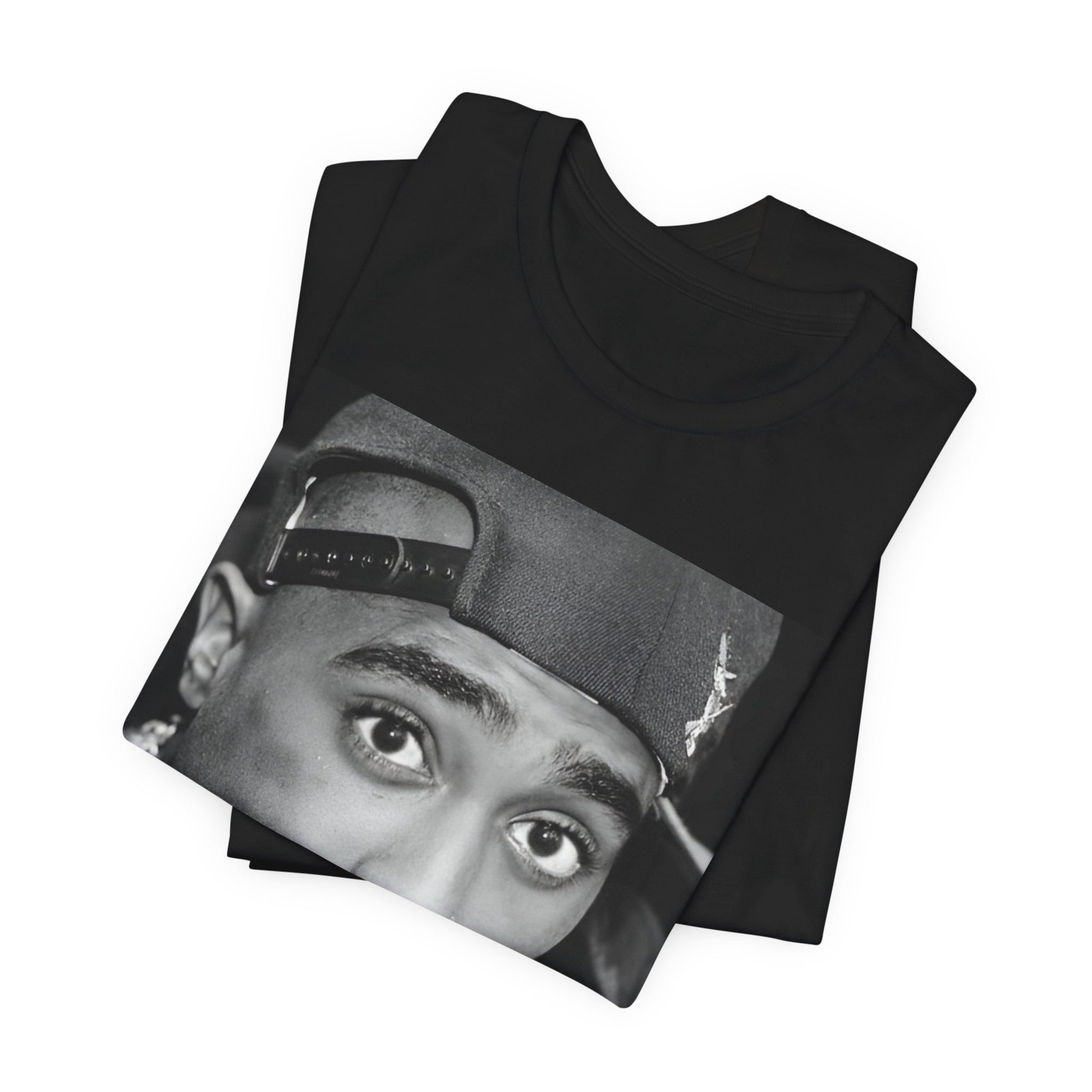 A black graphic t-shirt featuring a bold graphic of Tupac as a rap superstar.