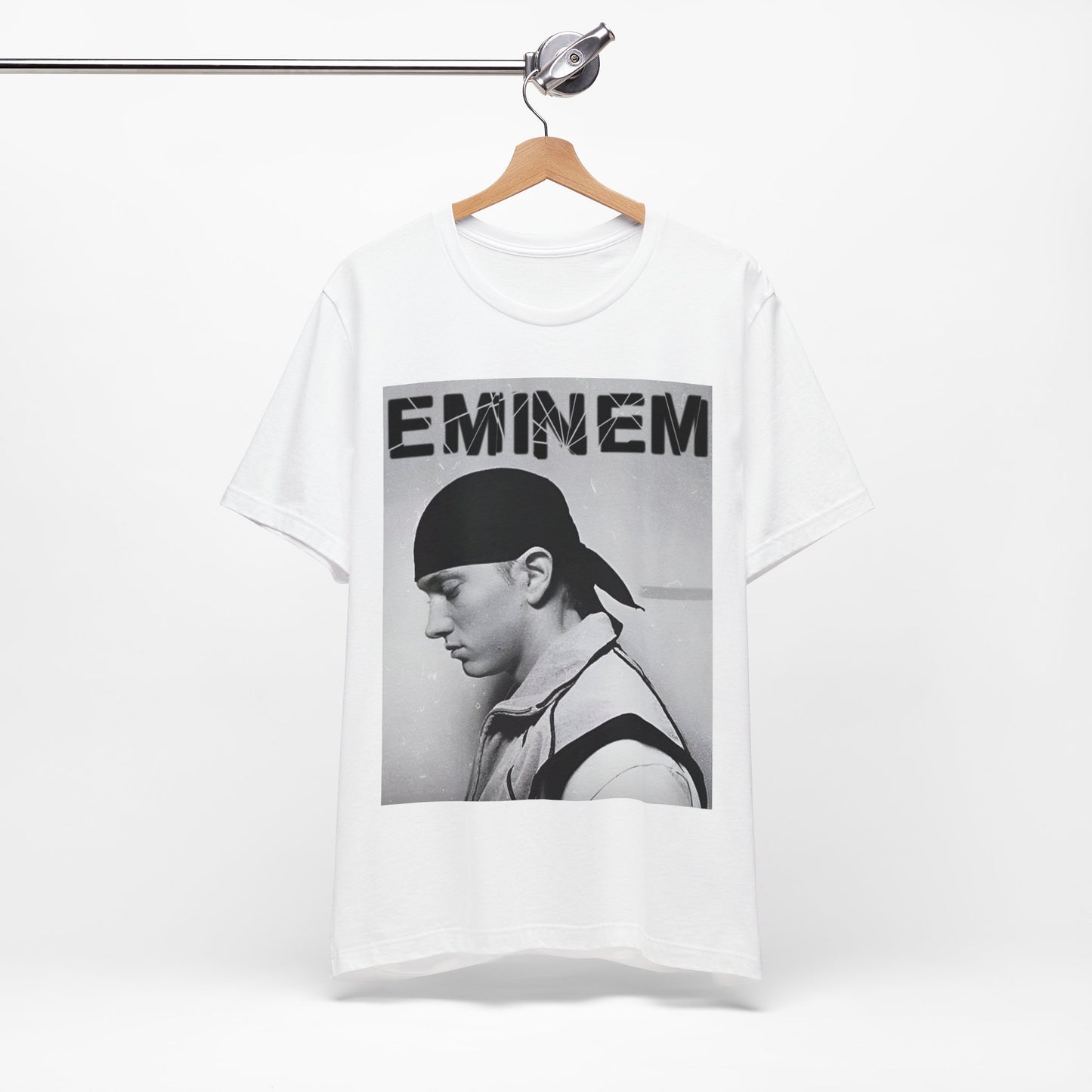 A black graphic t-shirt featuring a stylized graphic of Eminem as a modern rap legend.