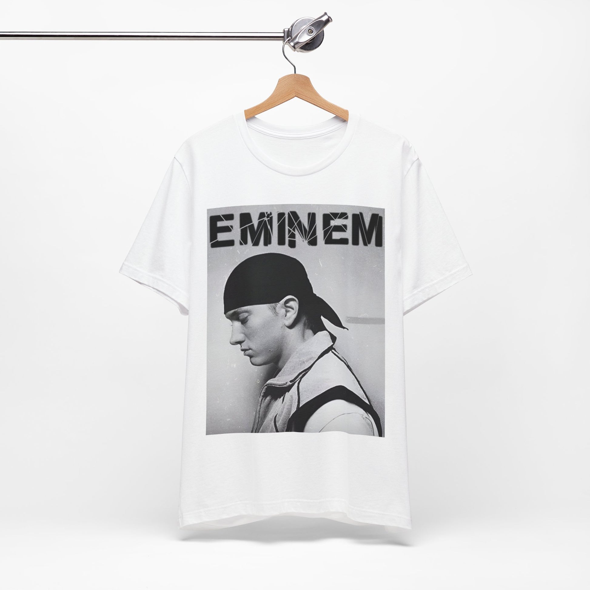 A black graphic t-shirt featuring a stylized graphic of Eminem as a modern rap legend.