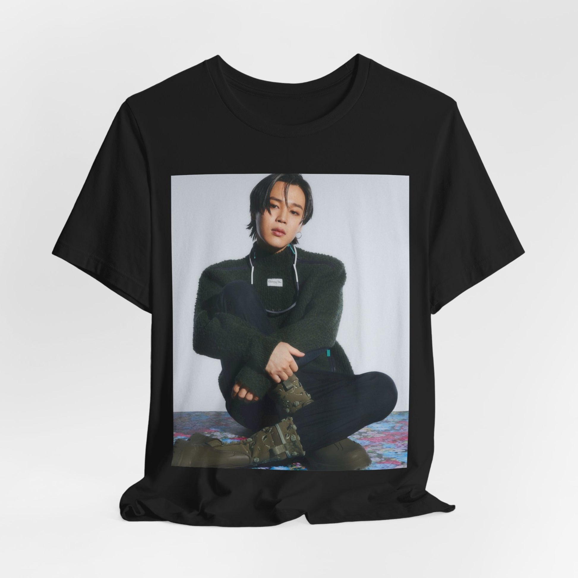 A black graphic t-shirt featuring a modern K-Pop essential graphic of Jimin.