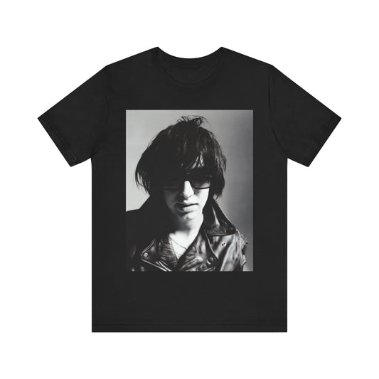 A black graphic t-shirt featuring a graphic related to The Strokes' 'Reptilia' song or era.