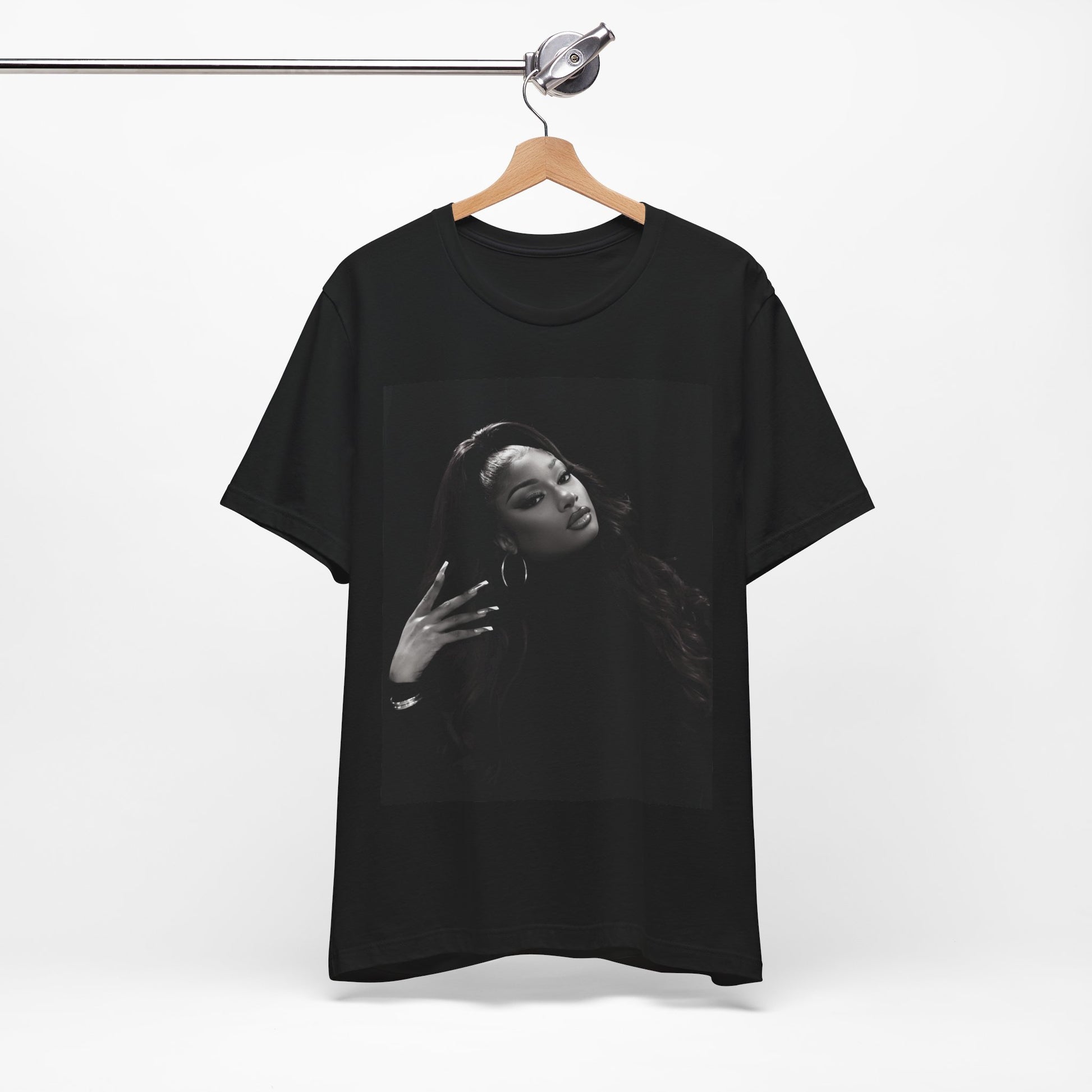 A black graphic t-shirt featuring a black and white, monochrome graphic or photo of Megan Thee Stallion.