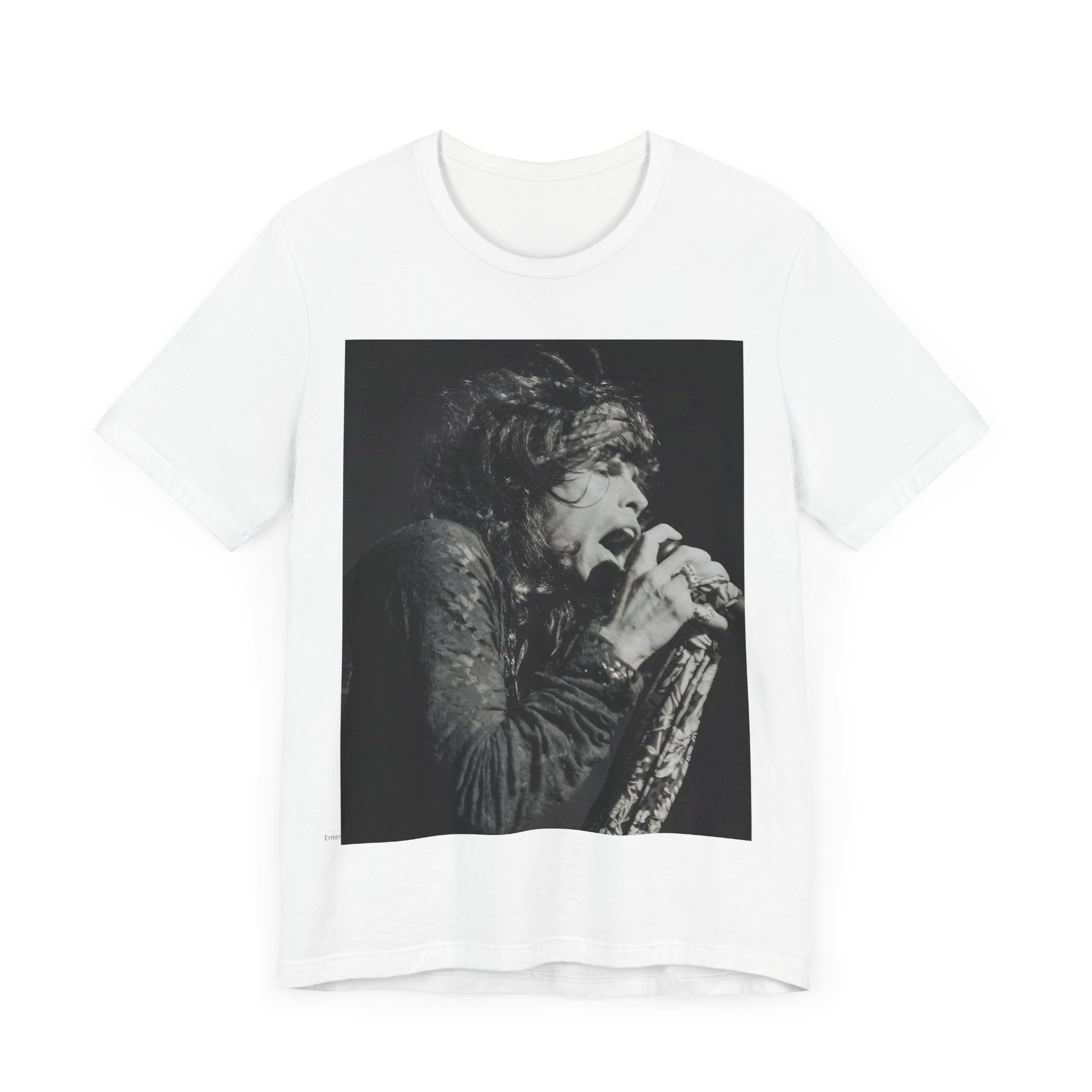 A black graphic t-shirt featuring a retro 70s-style illustration or photo of Aerosmith, designed to evoke their 'On Tour' presence, possibly with band members on stage or tour bus imagery.