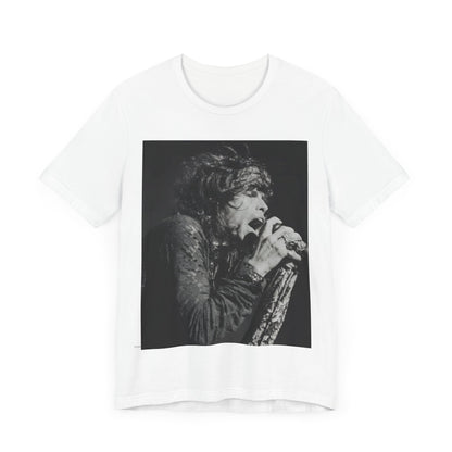 A black graphic t-shirt featuring a retro 70s-style illustration or photo of Aerosmith, designed to evoke their 'On Tour' presence, possibly with band members on stage or tour bus imagery.