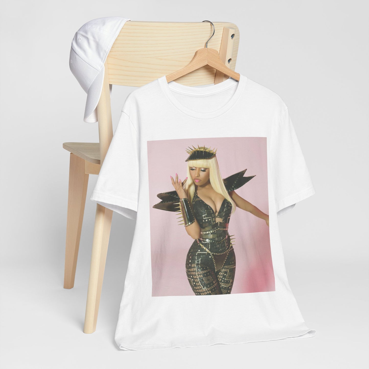 A black graphic t-shirt featuring a high fashion street vibe graphic of Nicki Minaj.