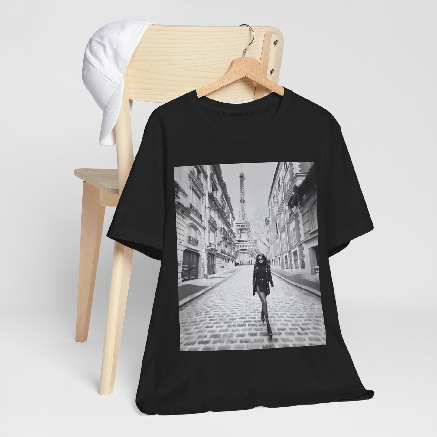 A black graphic t-shirt featuring a black and white photo of Selena Gomez in Paris.