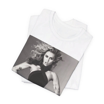 A black graphic t-shirt featuring a bold graphic of Miley Cyrus as a pop superstar.