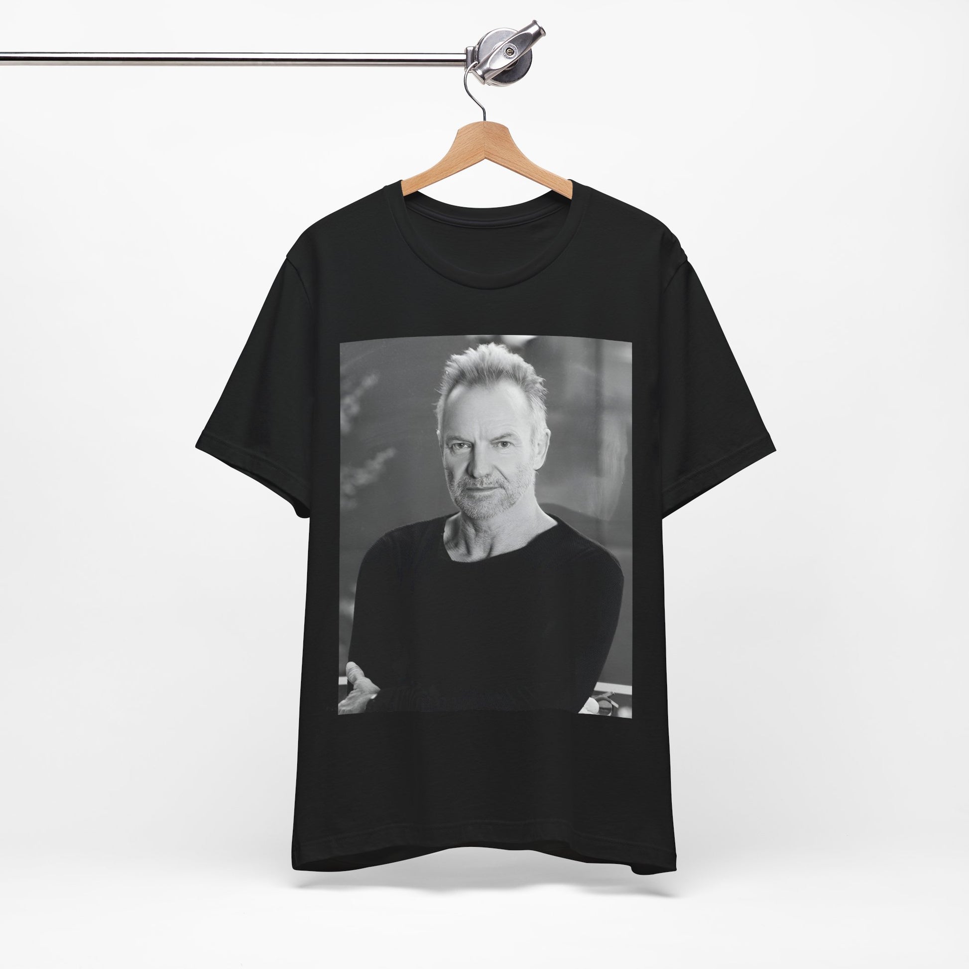 A black graphic t-shirt featuring a vintage graphic related to Sting's 'Desert Rose' song or era.