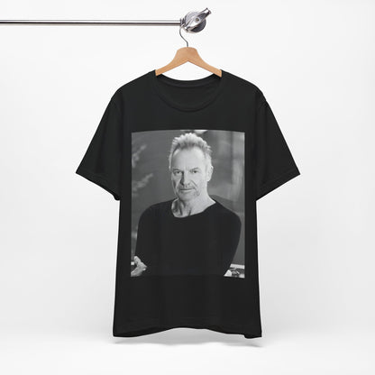 A black graphic t-shirt featuring a vintage graphic related to Sting's 'Desert Rose' song or era.