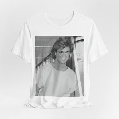 A black graphic t-shirt featuring an 80s black and white vintage photo or graphic of George Michael.
