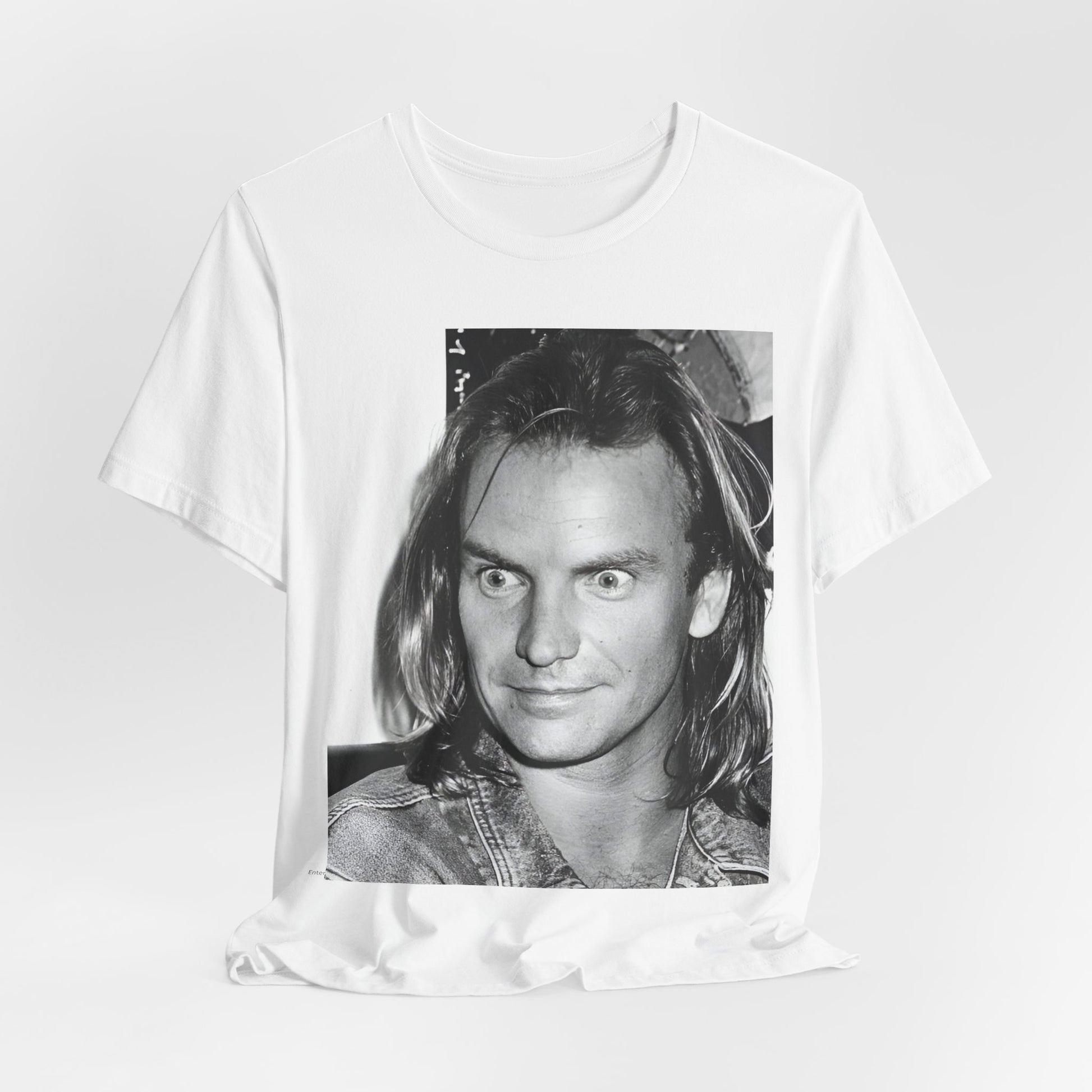 A black graphic t-shirt featuring a retro graphic related to Sting's 'Synchronicity' album era.