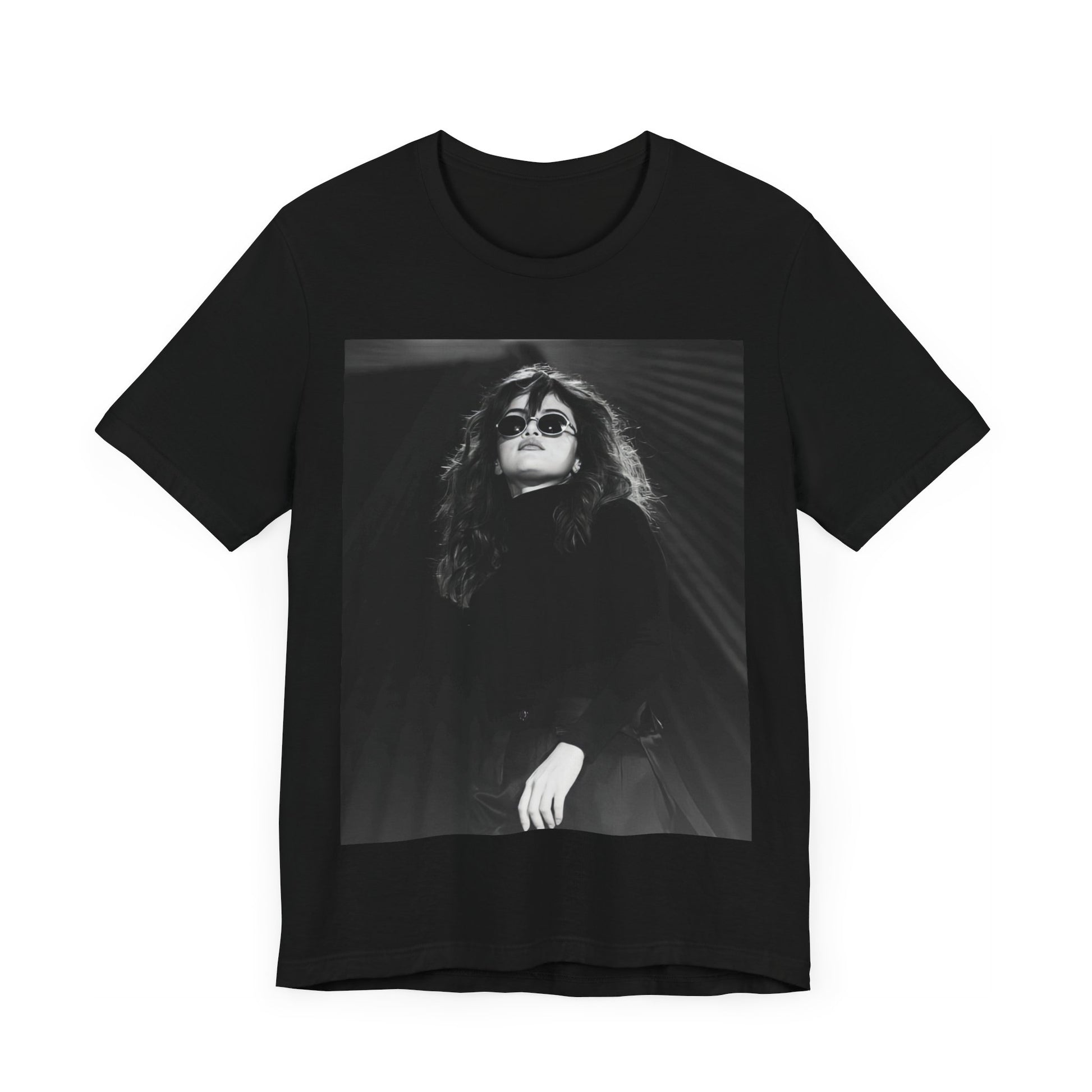 A black graphic t-shirt featuring a black and white, monochrome graphic or photo of Selena Gomez.