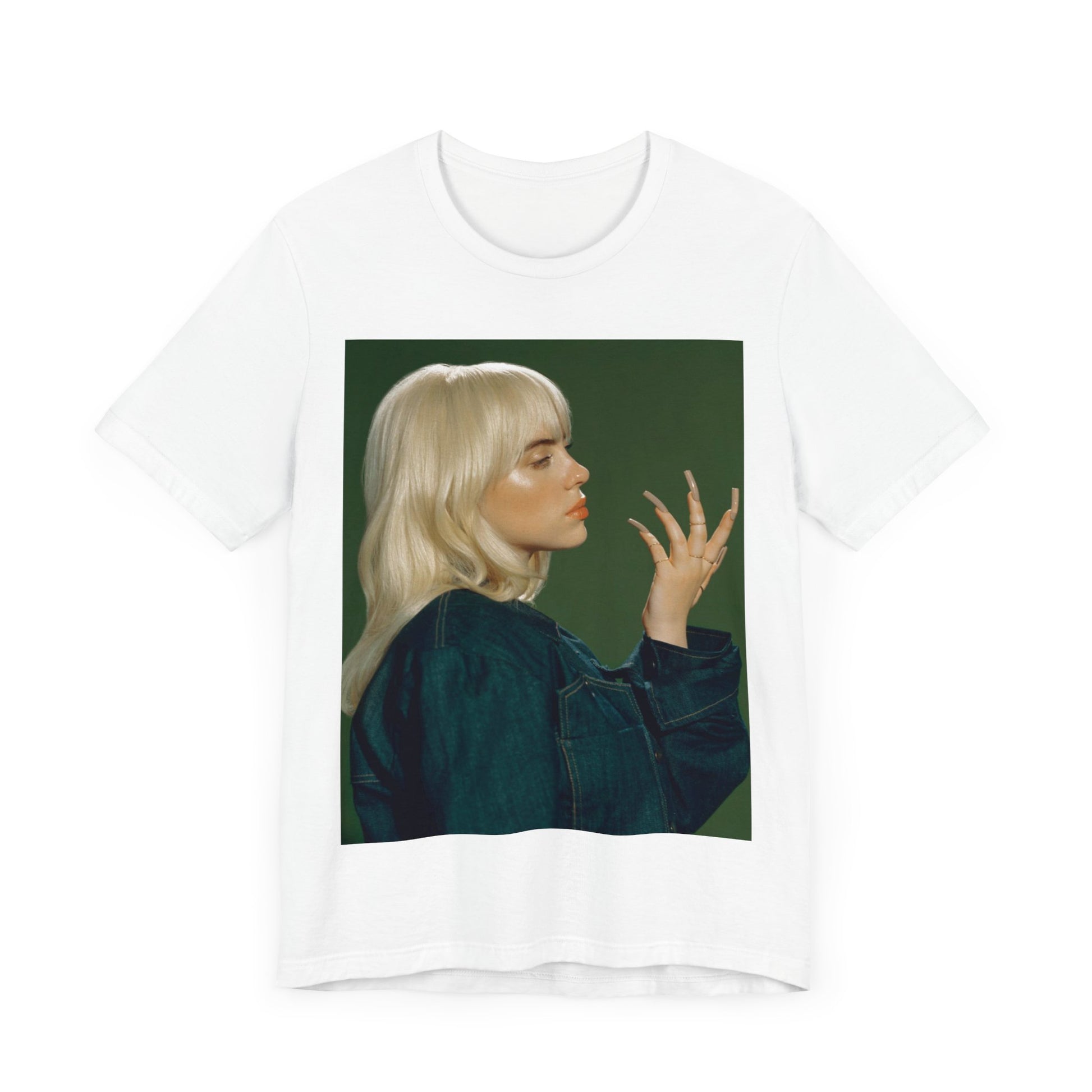 A vintage-style portrait of Billie Eilish with platinum blonde hair and long nails, wearing a denim jacket against a green background.