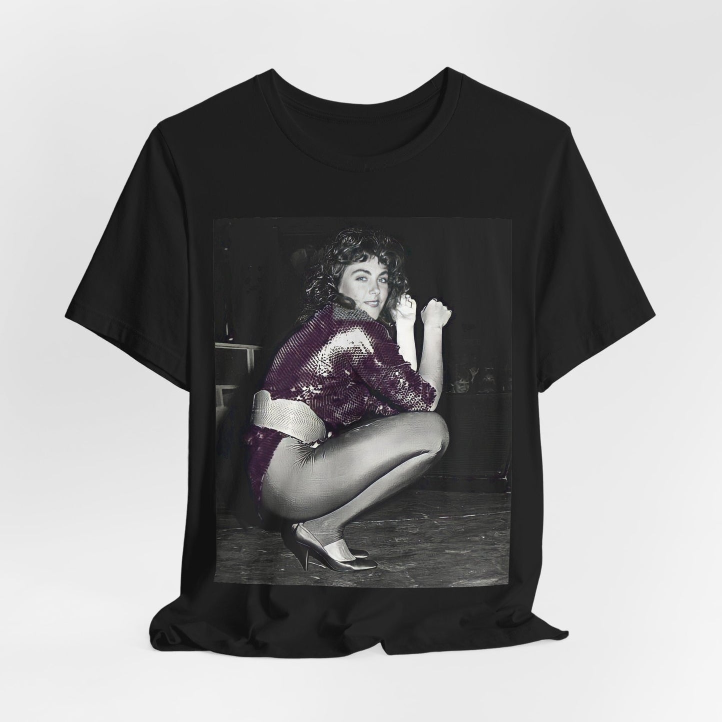 A black graphic t-shirt featuring a graphic of Laura Branigan as an 80s disco pop queen.