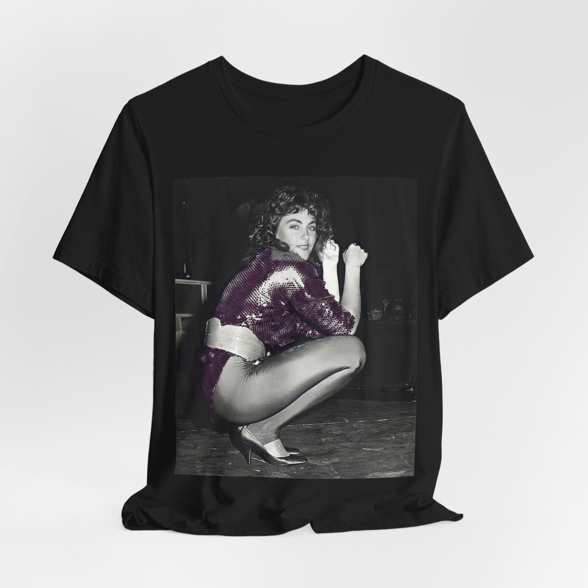 A black graphic t-shirt featuring a graphic of Laura Branigan as an 80s disco pop queen.