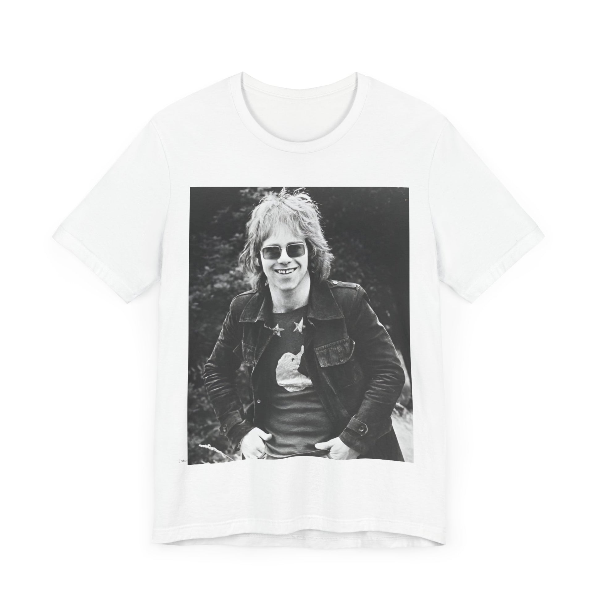 A black graphic t-shirt featuring a 70s black and white monochrome graphic or photo of Elton John.