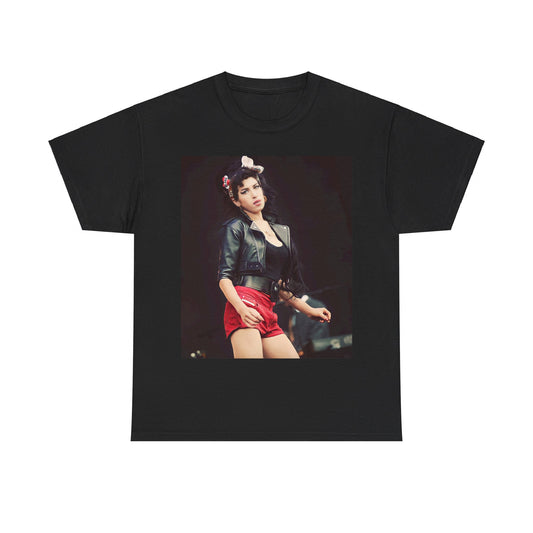 A black graphic t-shirt featuring a photo or illustration of Amy Winehouse on stage, with leather elements and a prominent red background or lighting.