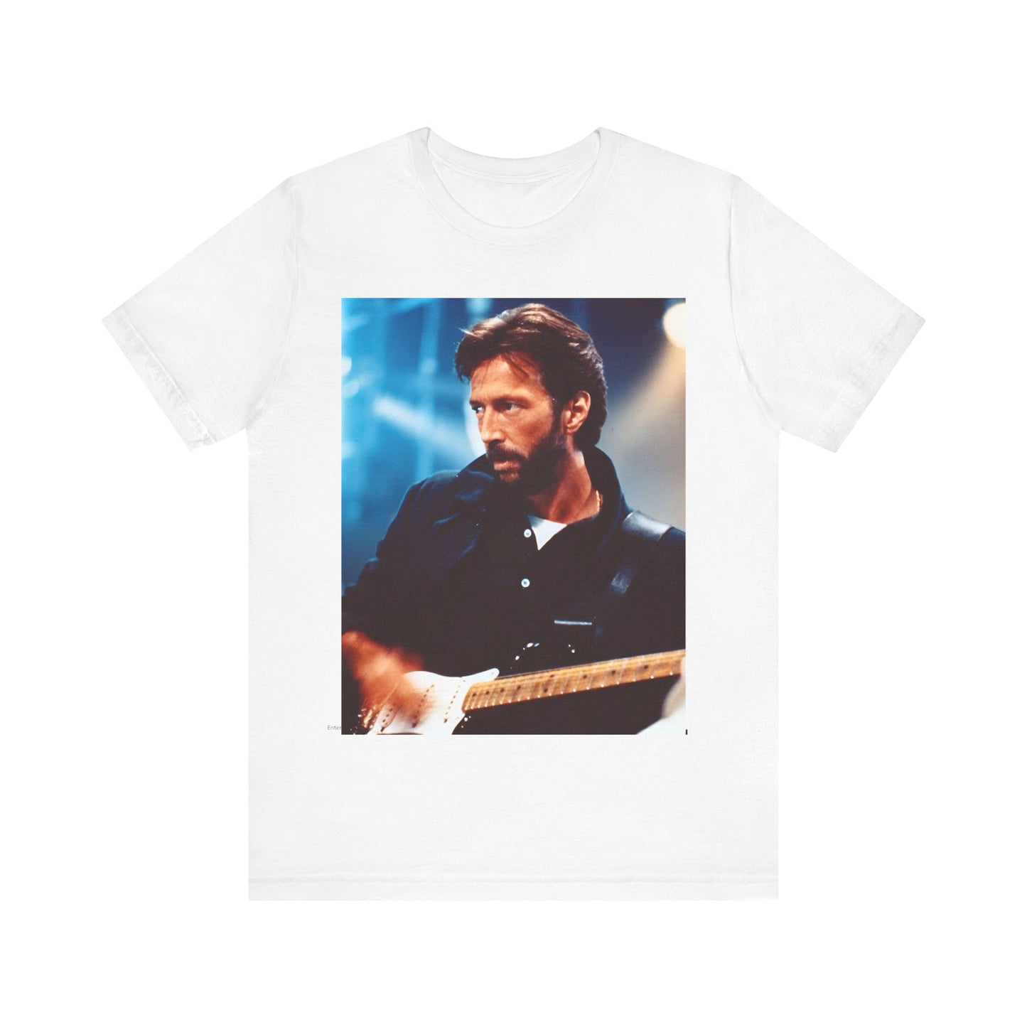 A black graphic t-shirt featuring a retro graphic or photo of Eric Clapton performing live on stage.