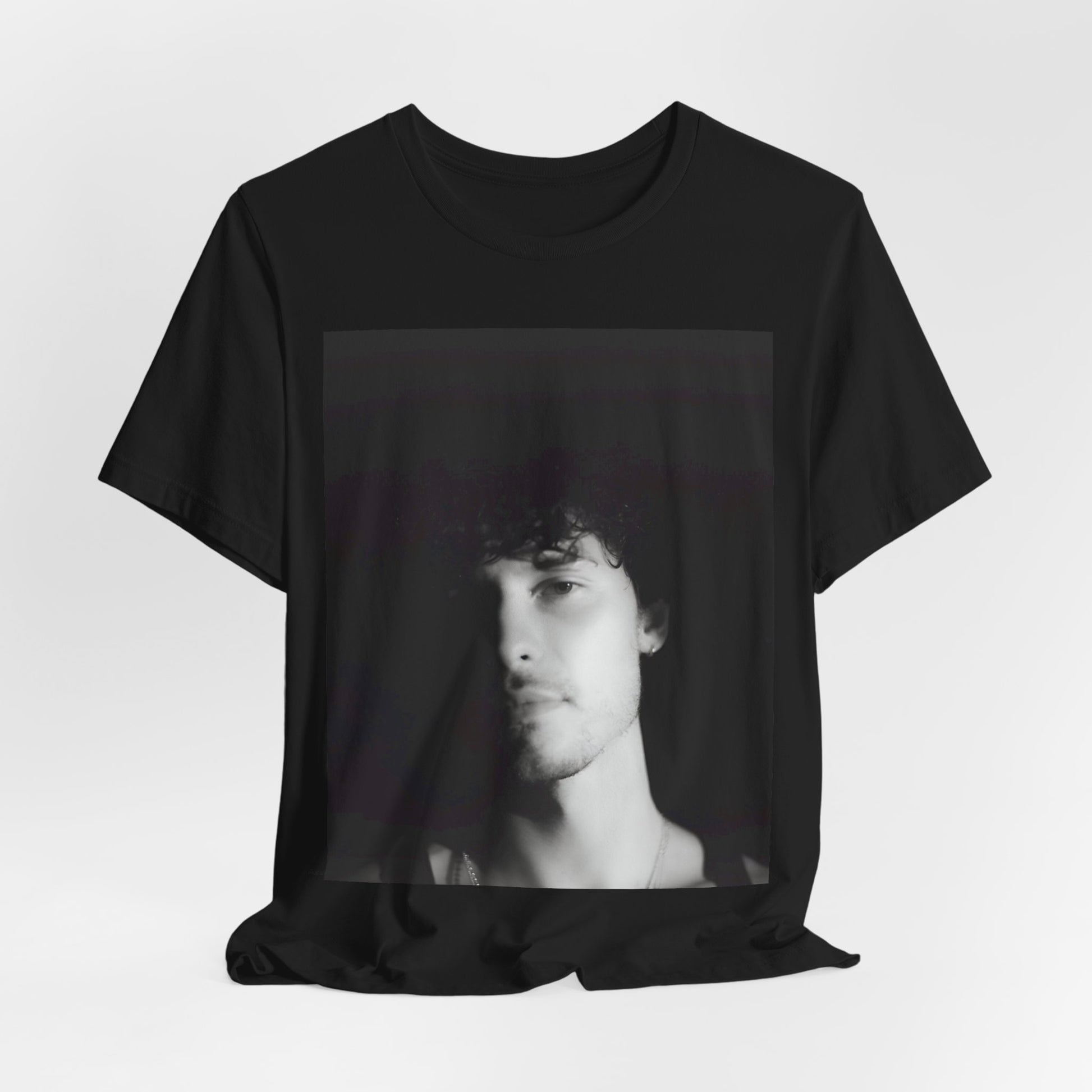 A black graphic t-shirt featuring a black and white portrait photo of Shawn Mendes.