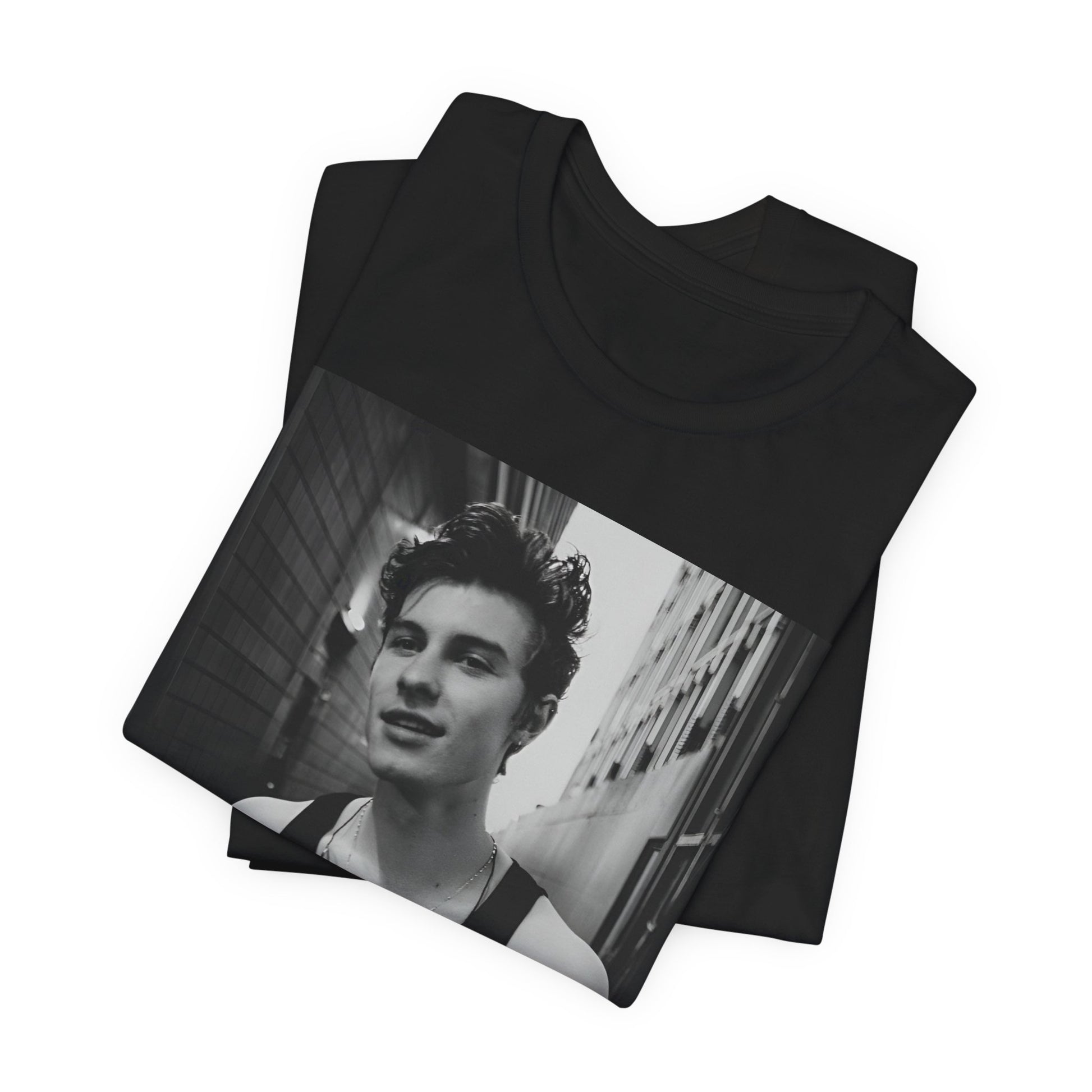 A black graphic t-shirt featuring a vintage black and white portrait graphic or photo of Shawn Mendes.