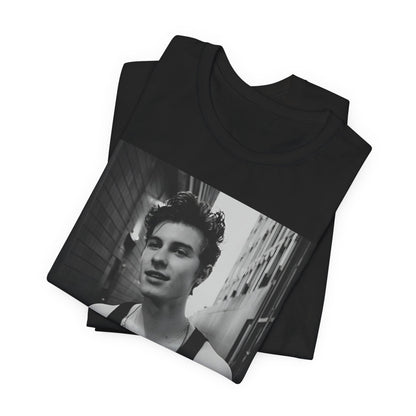 A black graphic t-shirt featuring a vintage black and white portrait graphic or photo of Shawn Mendes.