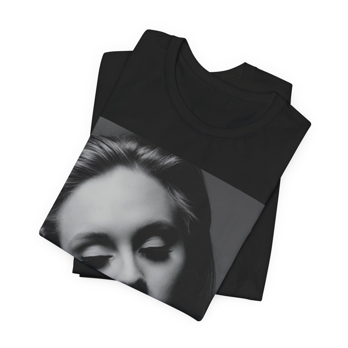 A black graphic t-shirt featuring the album cover art for Adele's '21' album, showing a close-up portrait of her with a contemplative expression.