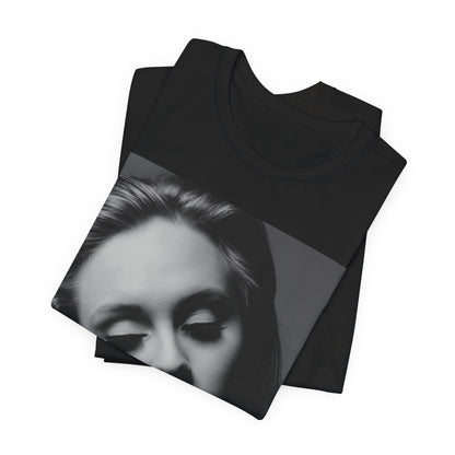 A black graphic t-shirt featuring the album cover art for Adele's '21' album, showing a close-up portrait of her with a contemplative expression.