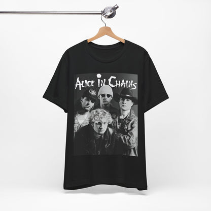 A black graphic t-shirt featuring a black and white photographic portrait of the band Alice In Chains, capturing their iconic grunge look.