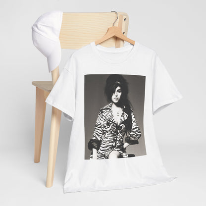 A black graphic t-shirt featuring a vintage black and white portrait of Amy Winehouse, showing her with her signature beehive and soulful expression.