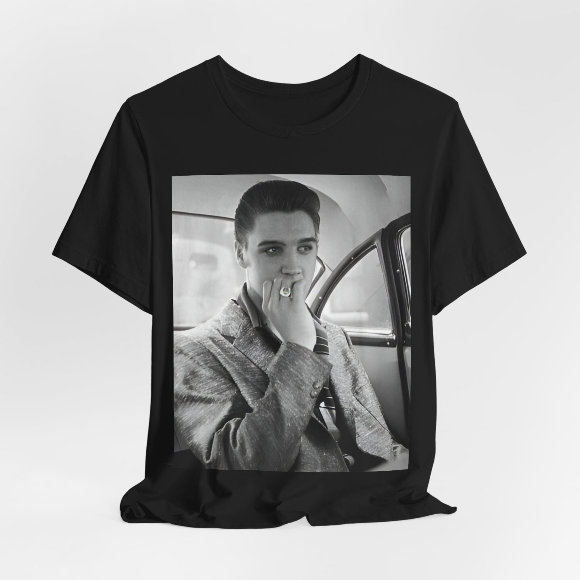 A black graphic t-shirt featuring a classic 50s era graphic of Elvis Presley.