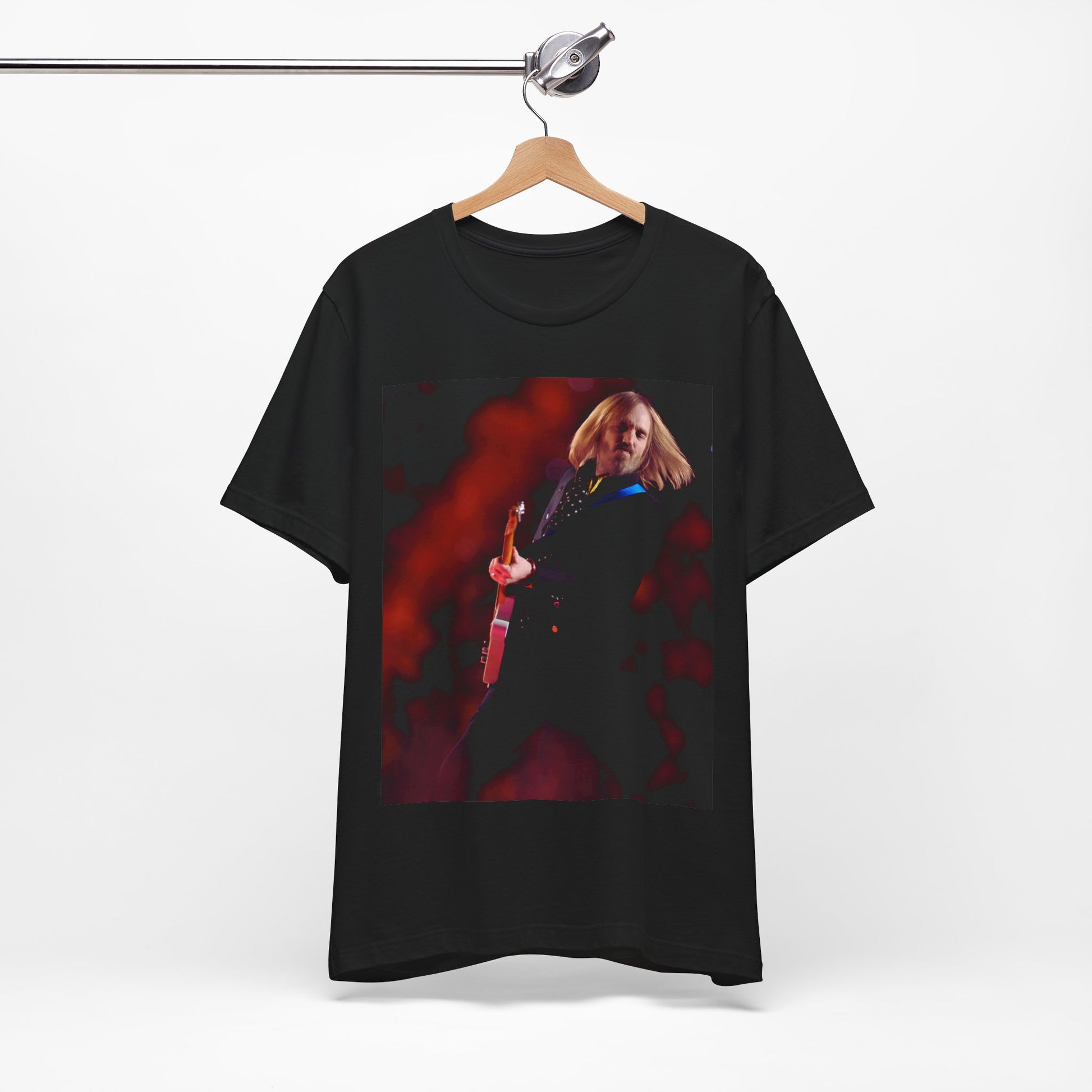 A black graphic t-shirt featuring a graphic or photo of Tom Petty as a powerhouse live performer.