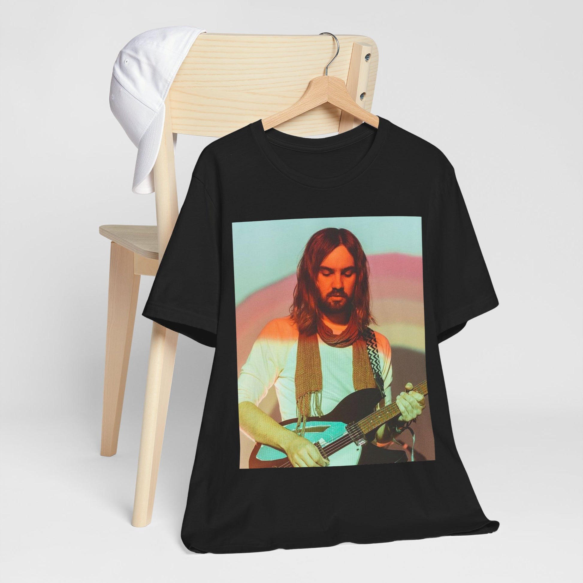 A black graphic t-shirt featuring a dream rock aesthetic graphic of Tame Impala.