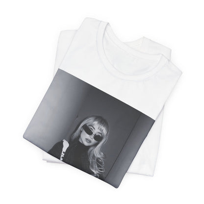 A black graphic t-shirt featuring a black and white glam pop diva graphic of Sabrina Carpenter.