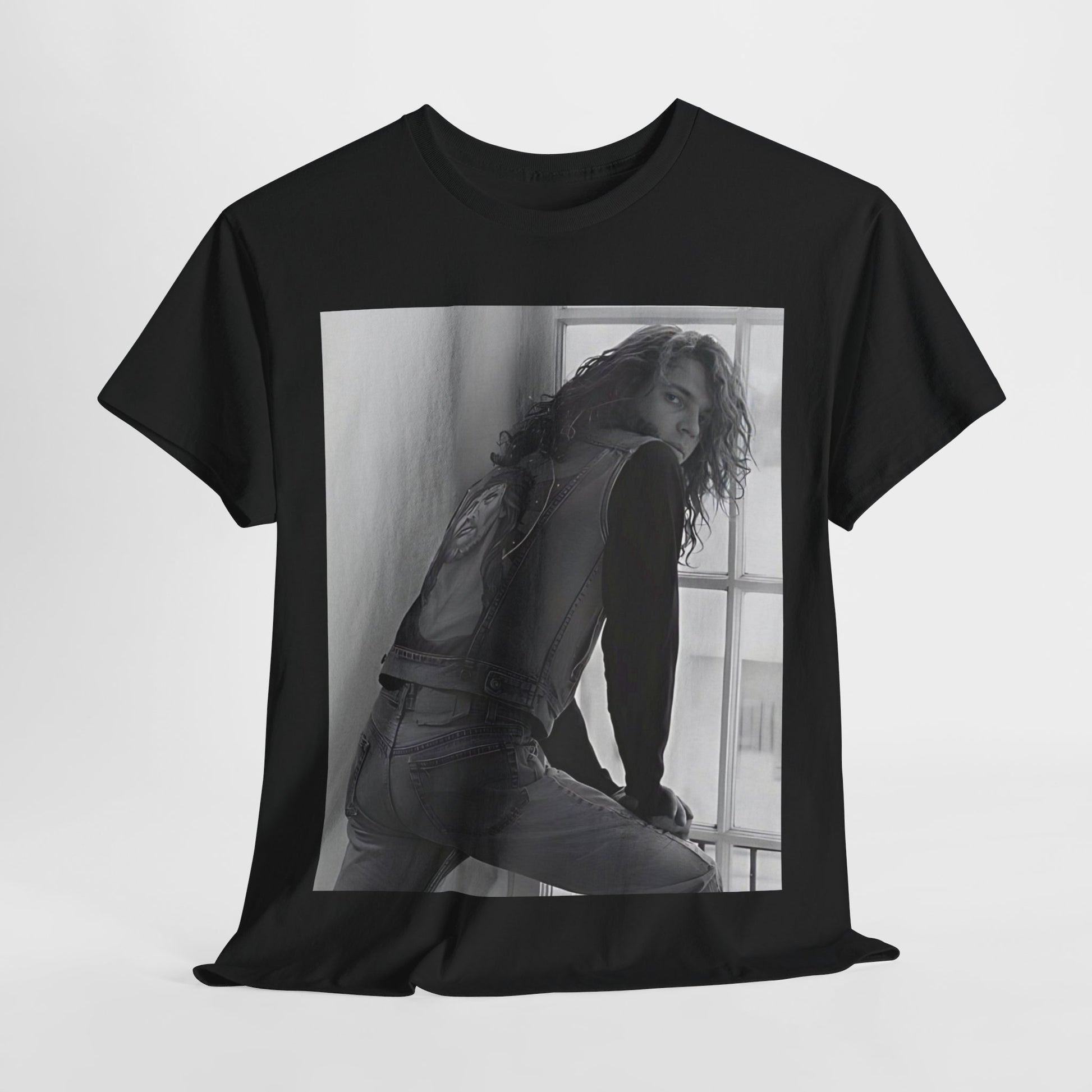 A black graphic t-shirt featuring a 90s black and white photo portrait of Michael Hutchence from INXS.