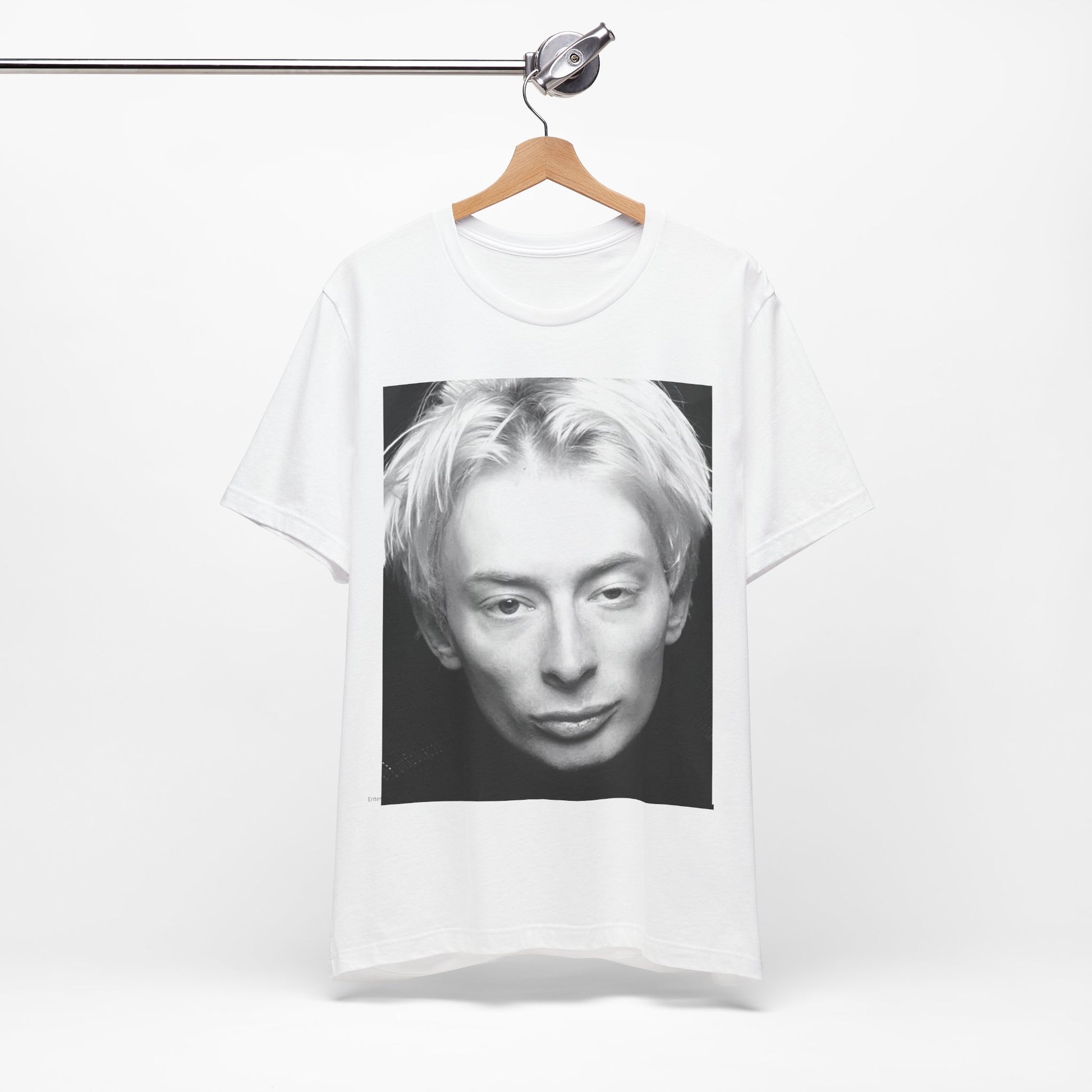 A black graphic t-shirt featuring a 90s black and white portrait photo of Thom Yorke from Radiohead.